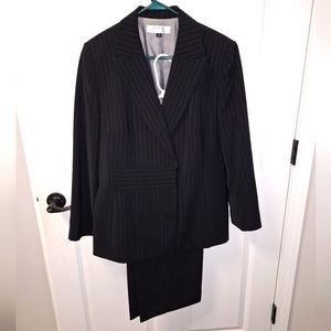 A Tahari ladies black with pinstripes pant suit in a size 16. EUC.